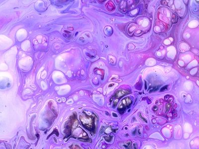 Abstract fluid light patterns on dark purple background